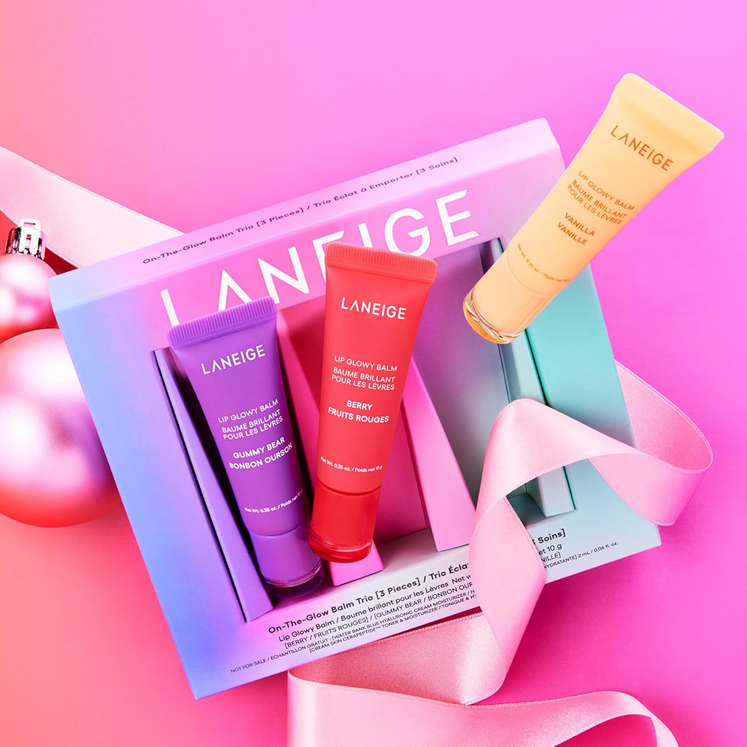 LANEIGE On-the-Glow Lip Balm Trio open set three shades flat lay
