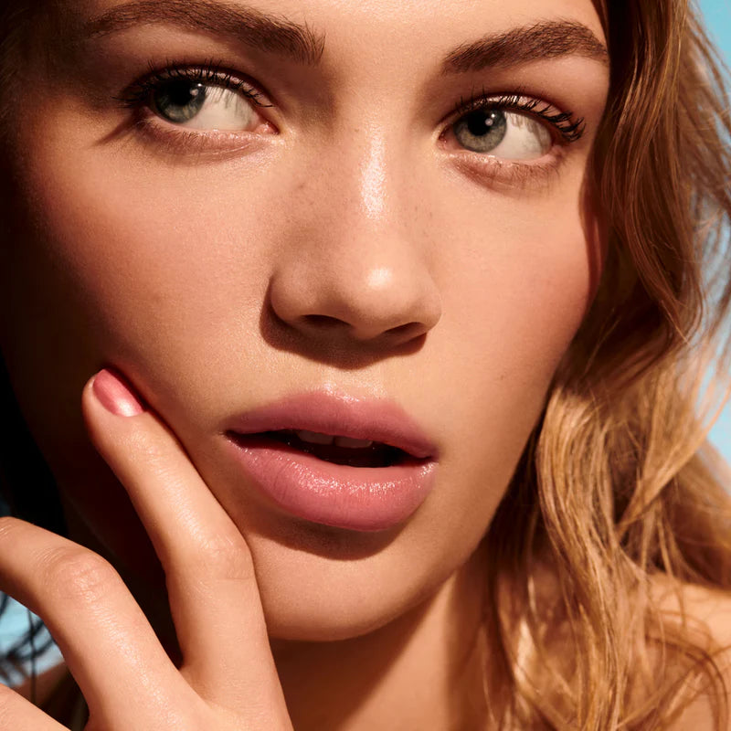 Kylie Cosmetics Tinted Butter Balm model wearing Baby Pink shade glossy finish
