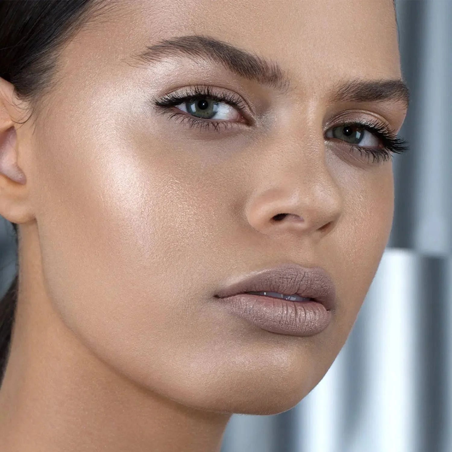 Natasha Denona Super Glow Highlighter Fair shade on model radiant strobing effect
